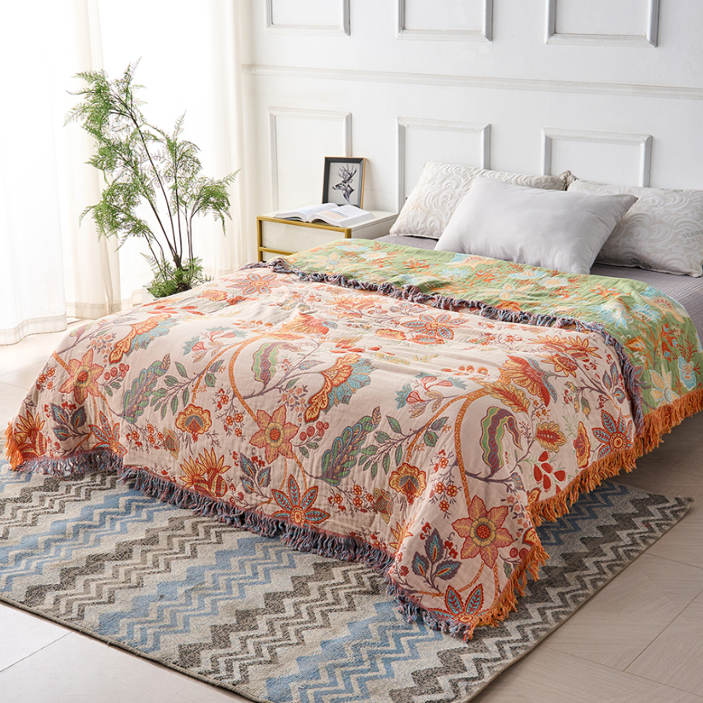 Coperta rustica con nappine floreali
